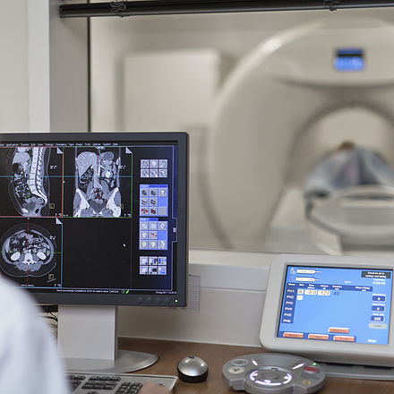 Doctor Operating CT Scanner